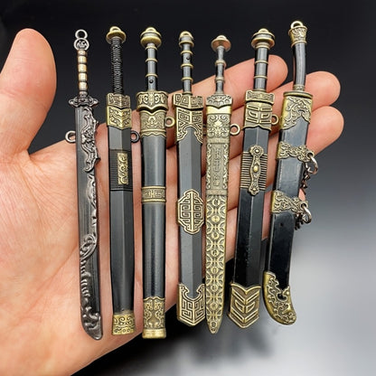 Miniature Metal Swords Set 7pcs Ancient-Inspired Collectible Pendant with Sheath – Military Theme Durable Metal Mini Sword Toy Gift for Anime Game Enthusiasts Ages 14+